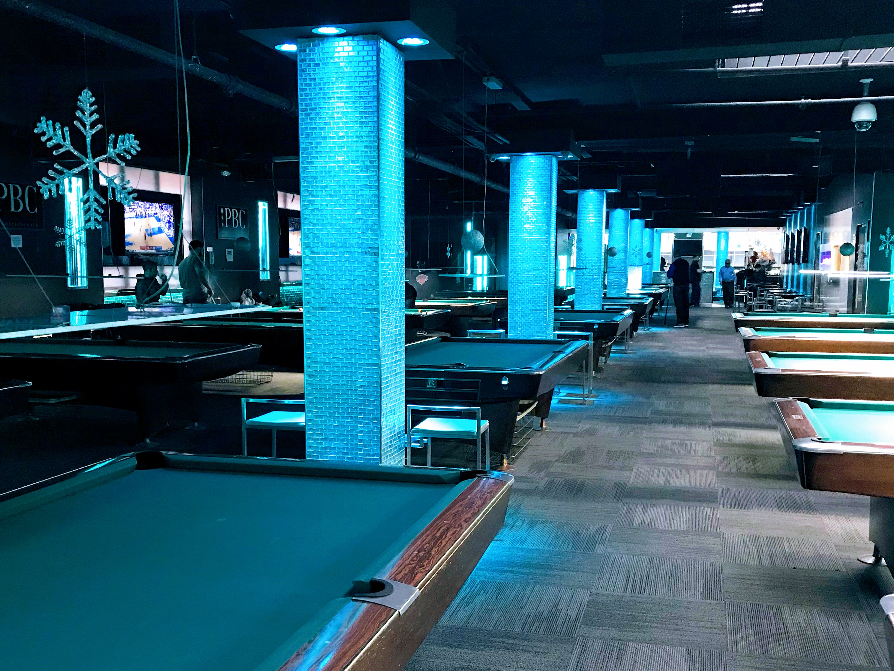 Post Billiards hall with pool tables